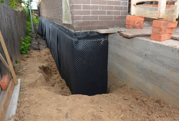 Happy homeowners after waterproofing job in Northfield